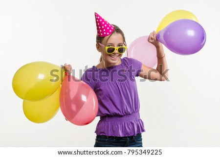 Happy teenage party girl 12-13 years old with balloons. White background