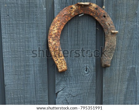 Lucky rusty old horseshoe hanging in the barn