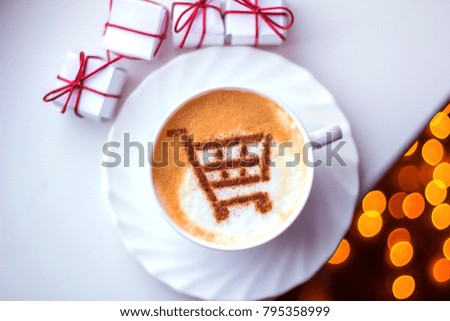 cappuccino in a white cup with a picture of a basket of cinnamon on milk foam