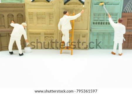 Miniature people: Worker  painting home with copy space using as background business concept.