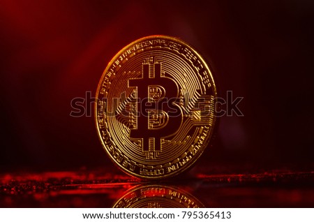 Bitcoin. Golden money Bitcoin on red and black background