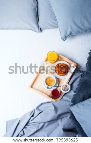 Breakfast Bed Wooden Tray Coffee Bun Grey Linens Bedding Sheet Pillow Coverlet Hotel Room Early Morning at Hotel Background Concept Interior Copy Space
