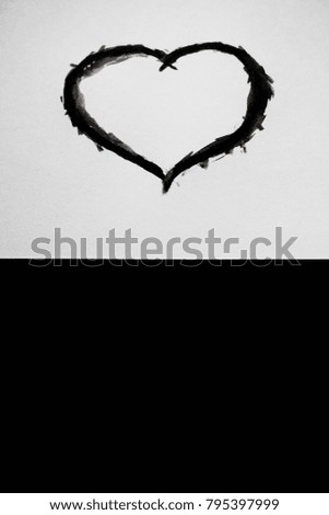black watercolor Painted Heart on black and white background