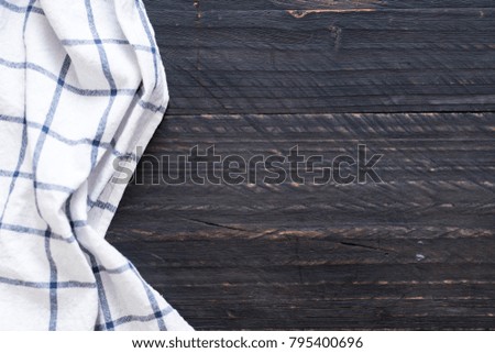 kitchen cloth (napkin) on wood background with copy space