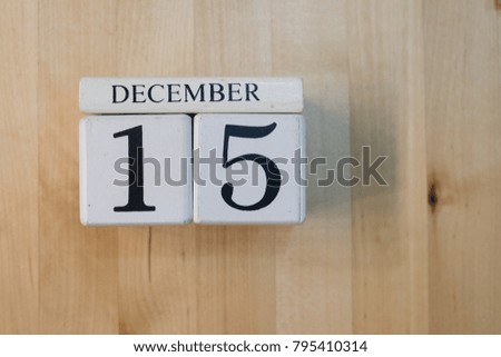 December 15th. Image of december 15 wooden color calendar on wood wall background. empty space for text.