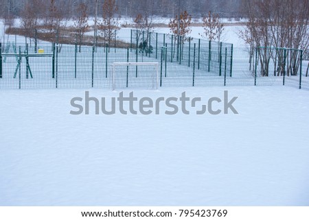 Playground for mini-football fields covered with snow