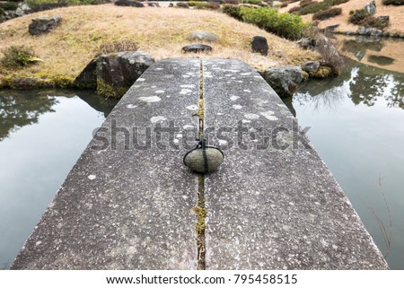 Tome Ishi (Stop Stone) on Bridge in Traditional Garden