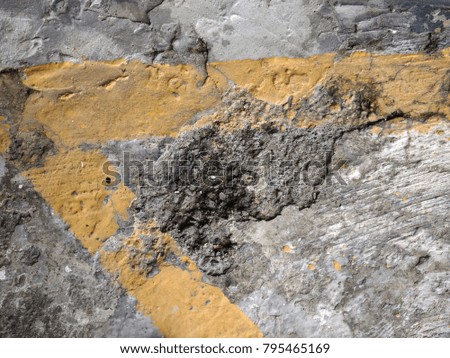 Abstract grunge cement floor with yellow paint for texture background