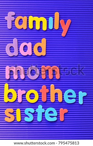 The words family, dad, mom, brother and sister on a blue background