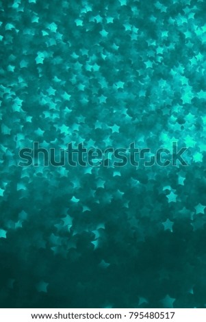 Turquoise star shape bokeh background