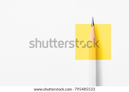 Minimalist template with copy space by top view close up macro photo of wooden yellow pencil isolated on white texture paper and combine with yellow square. Flash light made smooth shadow from pencil. Royalty-Free Stock Photo #795485533