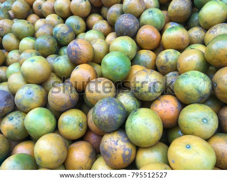 Many orange have some good and rotten fruits background. The picture concepts are fruit, organic, orange, fresh.
