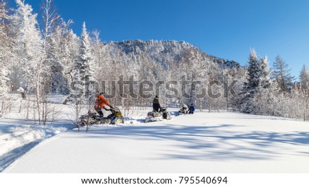 Walk on snowmobiles in the mountains of the Urals.