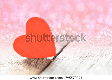 Heart on a wooden background. Background in the style of Valentine's Day.