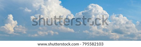 Panorama of the sky with fluffy clouds.