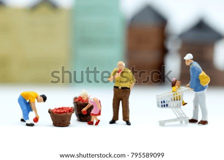 Miniature people : market of people with toy house background,business and family concept.