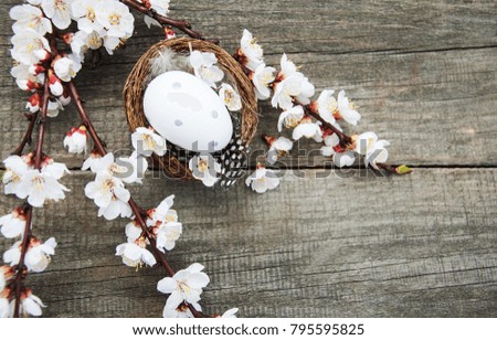 Easter eggs and spring  blossom on a old wooden background