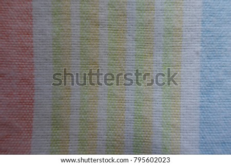 Top view of thin colorful striped fabric
