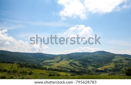Fantastic view of the alpine valley with blue sky