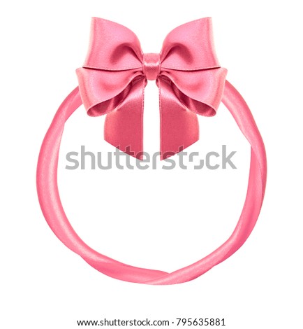 Frame from pink shiny satin bow and ribbons isolated on white background