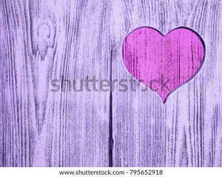 Pink heart carved in a wooden board. Background. Postcard, valentine.