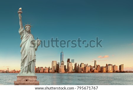 Manhattan Skyline with the Statue of Liberty in foreground, New York City. USA