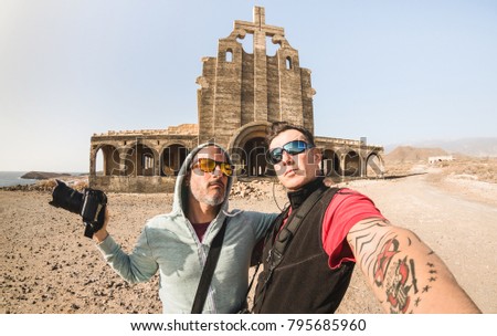 Adventurous best friends taking selfie at abandoned place in Tenerife - Wanderlust travel lifestyle enjoying moments and sharing happiness - Trip together around the world as alternative lifestyle
