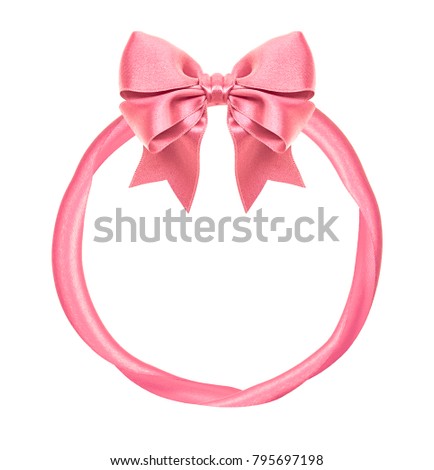 Circular frame from pink shiny silk bow and ribbons isolated on white background
