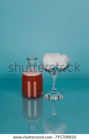 Cocktail on color background with glass reflection 