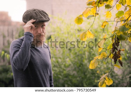 Autumn picture - man with beard and flat cap