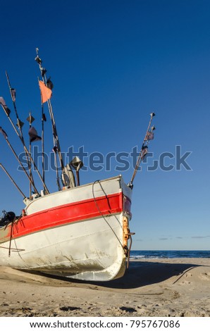 FISHING - Fishing boat on the sea shore