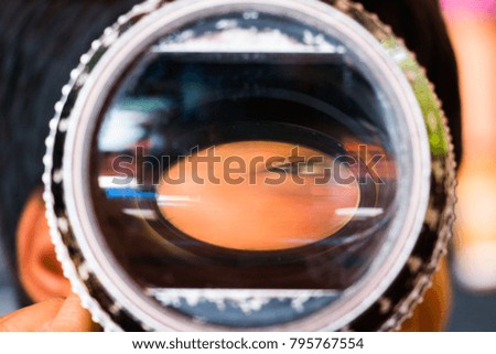 Closeup of a child's eye that sees through an analogous lens