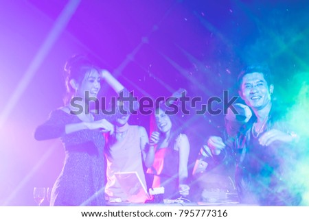 image blur. Group of dancing friends enjoying night party