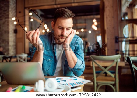 Desperate young student can't find inspiration for learning Royalty-Free Stock Photo #795812422