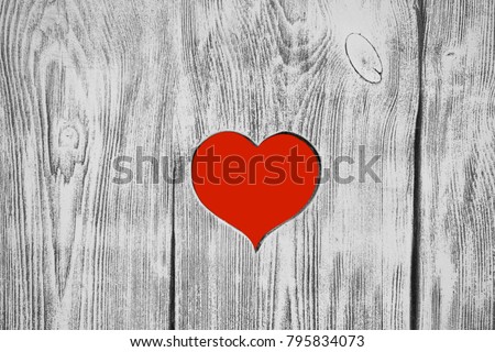 Red heart carved in a wooden board. Background. Postcard, valentine.