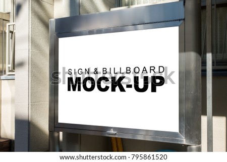 The mock up signboard outside building with clipping path, blank white space of billboard for outdoor advertising or marketing media