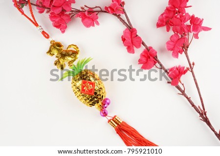 Chinese New Year flat lay background with assorted festival decorations. Chinese characters means good luck on wealth.