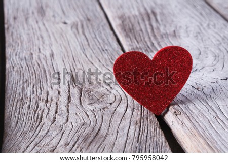 Valentine background with red glitter handmade heart on grey wood planks. Happy lovers day card mockup, copy space. Valentine's Day, love, romantic concept