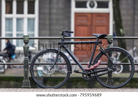 Typical Amsterdam bicycle (bell) parked  on the street  