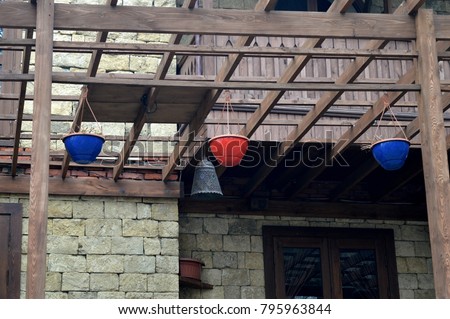 a unique photo from everyday life. two blue, one red pot.  baku azerbaijan