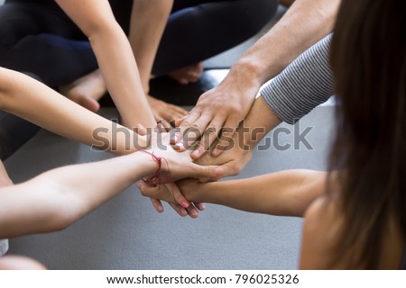Close up of high five hand gesture, symbol of common celebration or greeting, people planning to reach their goal, slap each other to start working together. Success and teamwork concept Royalty-Free Stock Photo #796025326