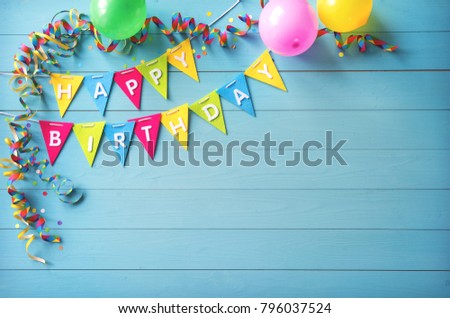 Happy birthday party background with text and colorful tools, top view