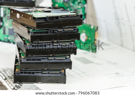 pile of hard drives at white background