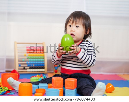 baby girl play toy at home