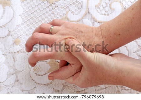 Strongly trembling hands in seniors. A woman with Parkinson's disease has her hands shaking
 Royalty-Free Stock Photo #796079698