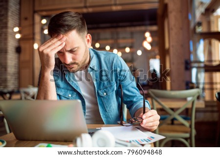 Modern young student having some learning problems  Royalty-Free Stock Photo #796094848