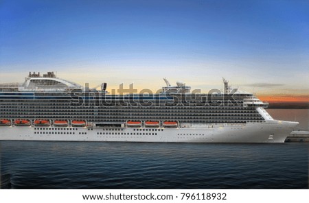 Luxury cruise ship at the port on sunset 
