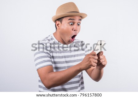 
Young asian man shocked when he looking smartphone Royalty-Free Stock Photo #796157800