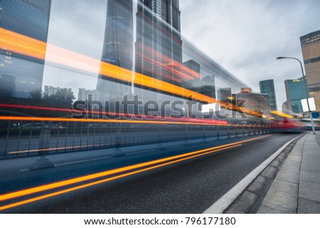 urban city road with motion bus at twilight, china
