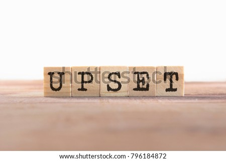 Upset Word Written In Wooden Cube